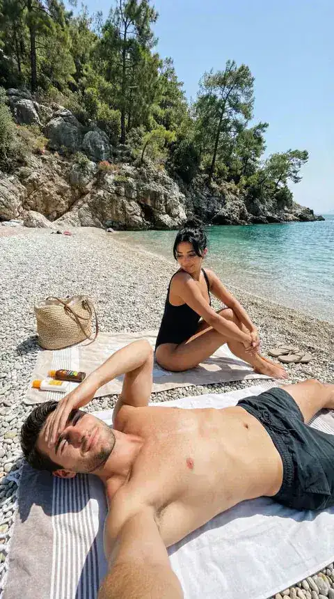 Couple relaxing together on a Mediterranean beach