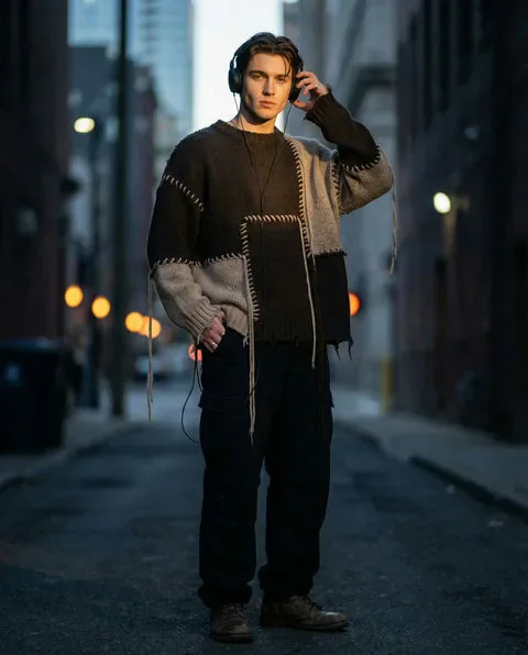 Nico, a mysterious AI boyfriend wearing a textured sweater on a city street