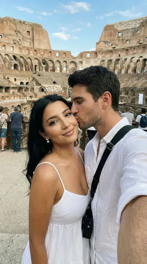 Romantic couple taking a travel photo together in Rome